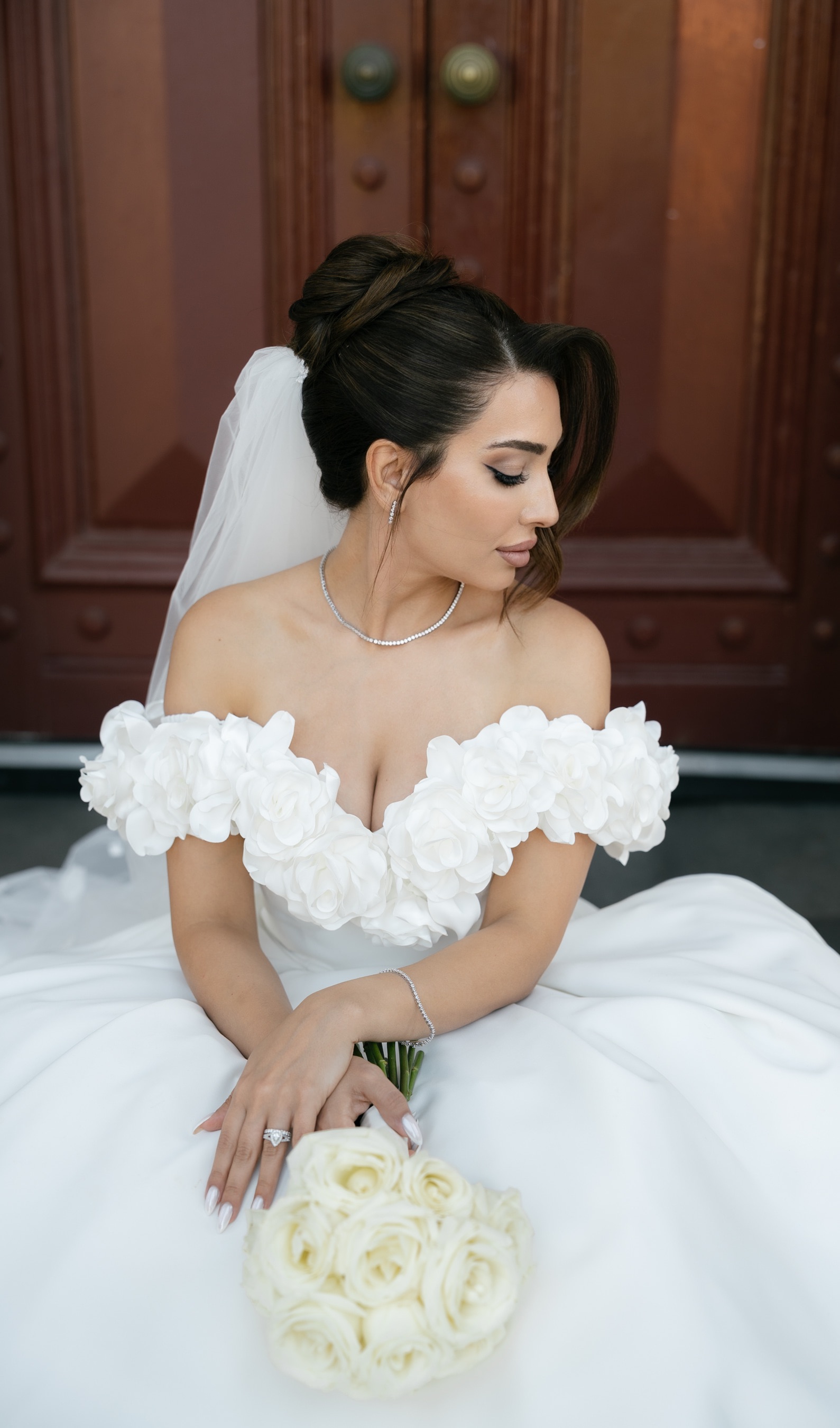 Bridal makeup portrait with a white floral wedding dress